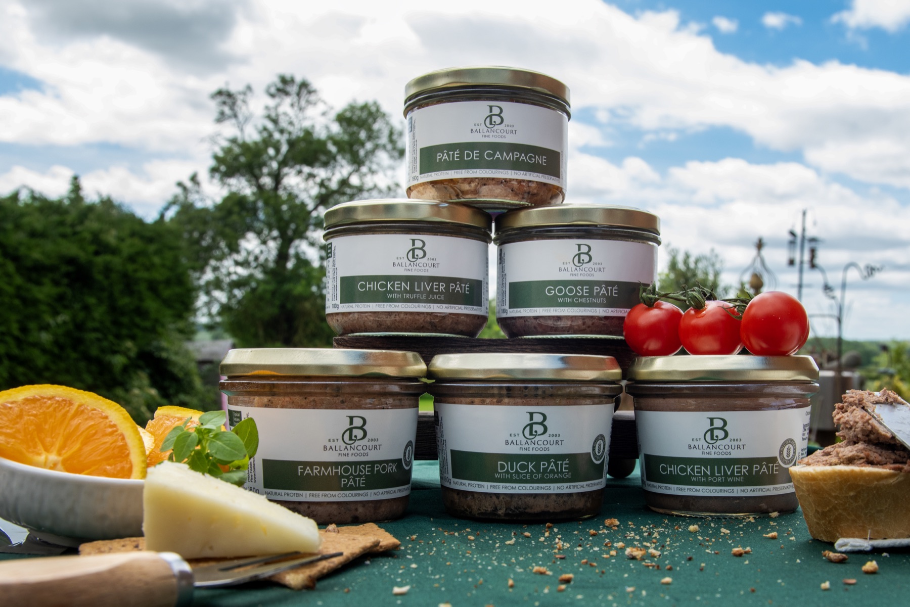 Ballancourt farmhouse pâté jars — pâté de campagne, duck and goose pâté in glass jars on a garden table