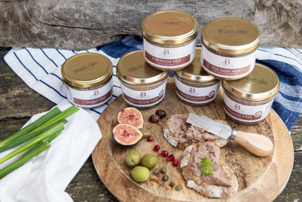 Ballancourt game pâté jars served with bread, fruit and olives