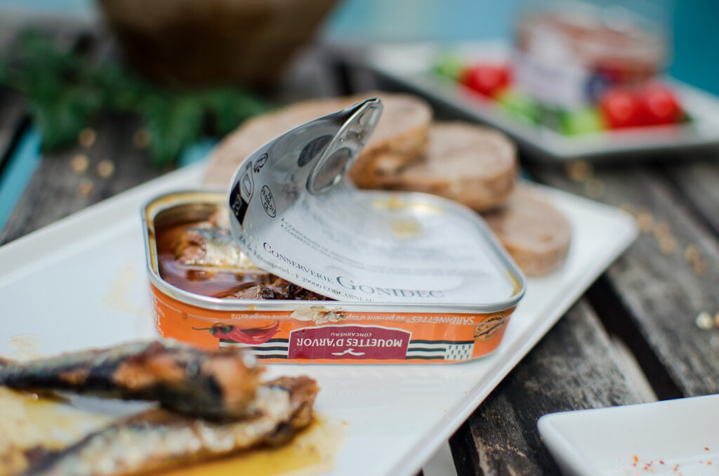 Open Mouettes d’Arvor tinned fish served with sliced bread