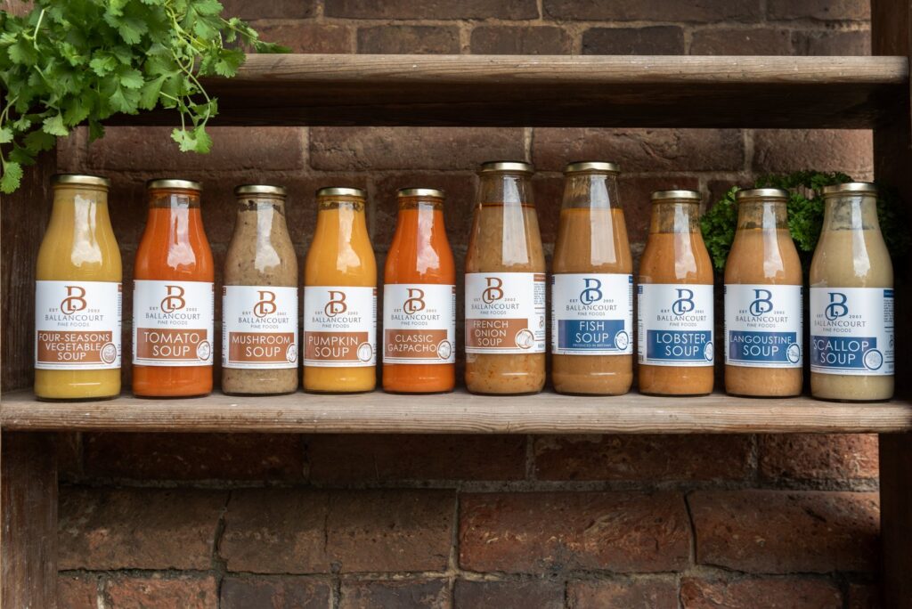Ballancourt vegetable and fish soup range displayed on wooden shelves